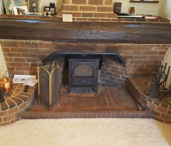 Stovax Stockton 5 Wood Burning Stove - with flat top installed in beautiful Arts and Crafts original fireplace in the Surrey Hills between Guildford and Dorking